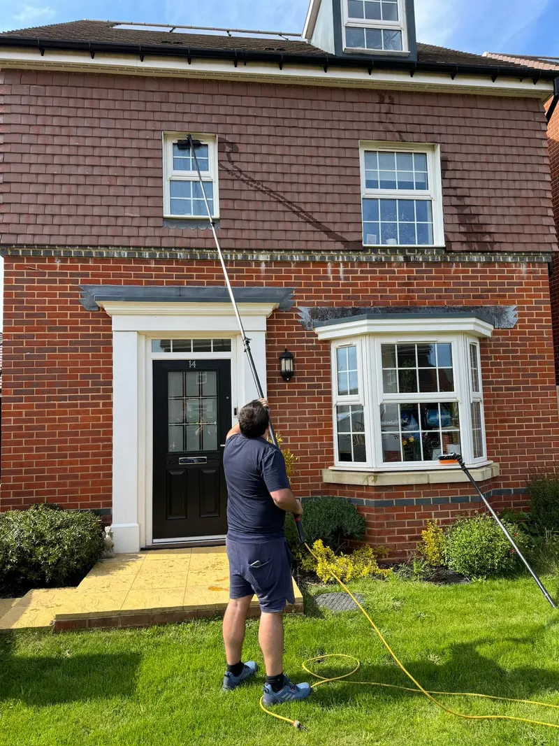 Cleaning the windows of a family home in Dorset with a pure-water pole