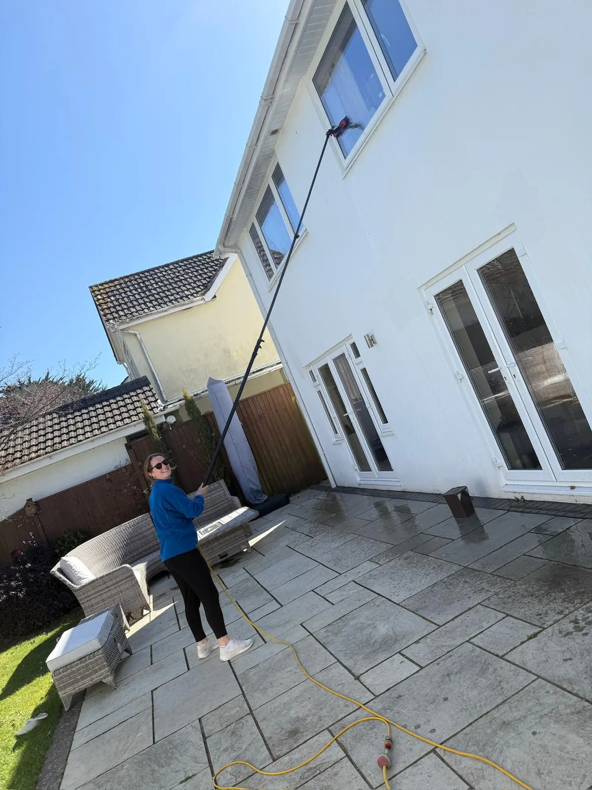 Reaching high glass at the rear of a large commercial property in Dorset